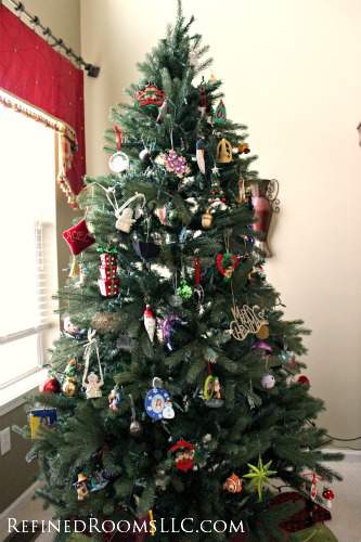 small artificial Christmas tree decorated by chldren.