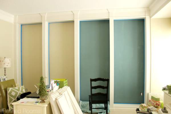 home office makeover in progress - painting bookshelf walls.