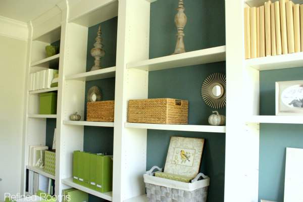 floor to ceiling custom built in shelves in a home office makeover.