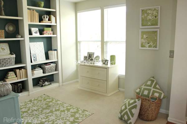 contemporary blue and green home office with lateral file cabinet and built in book shelves.