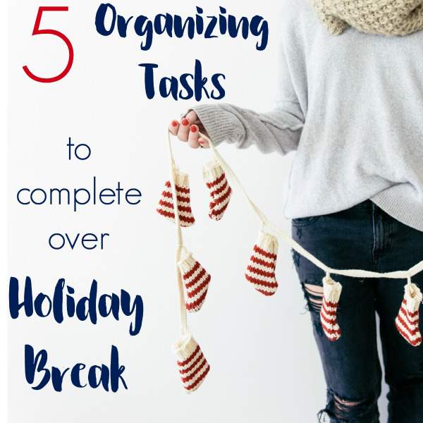 woman holding Christmas decoration - text "5 organizing tasks to complete over Holiday Break".