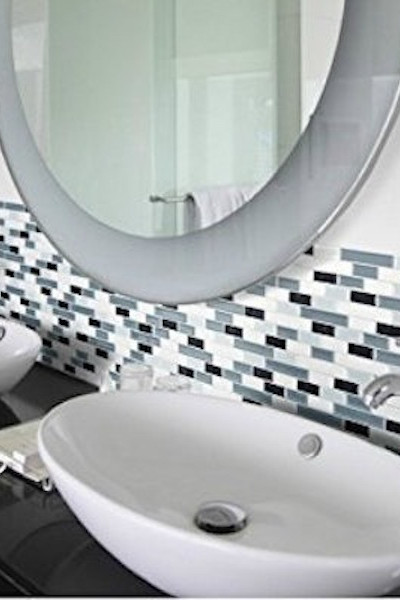 Use peel and stick tiles for an inexpensive upgrade when selling your home via Refined Rooms