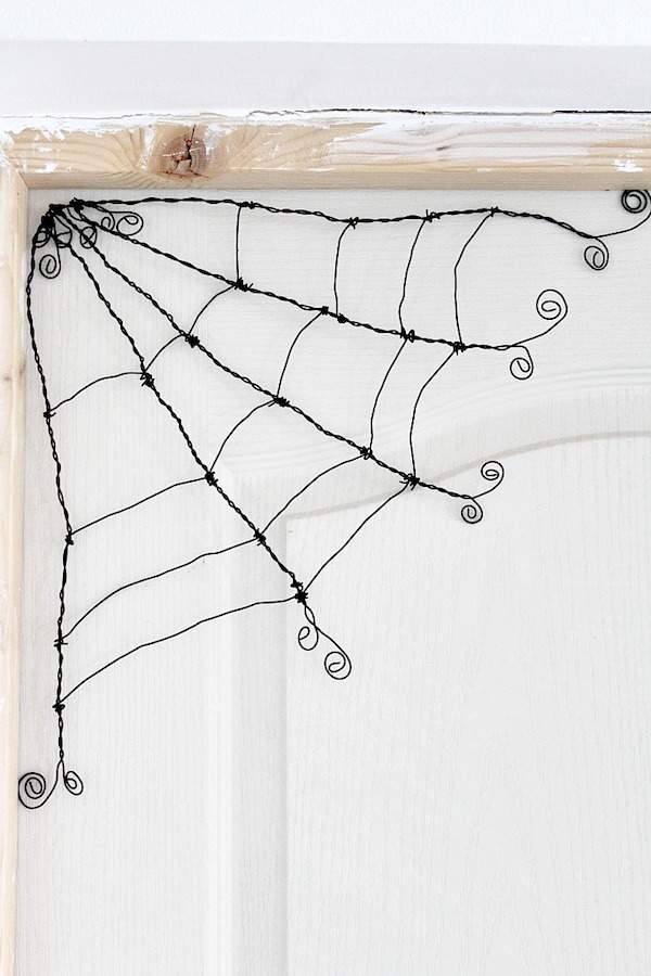 DIY wire spider web Halloween decoration.
