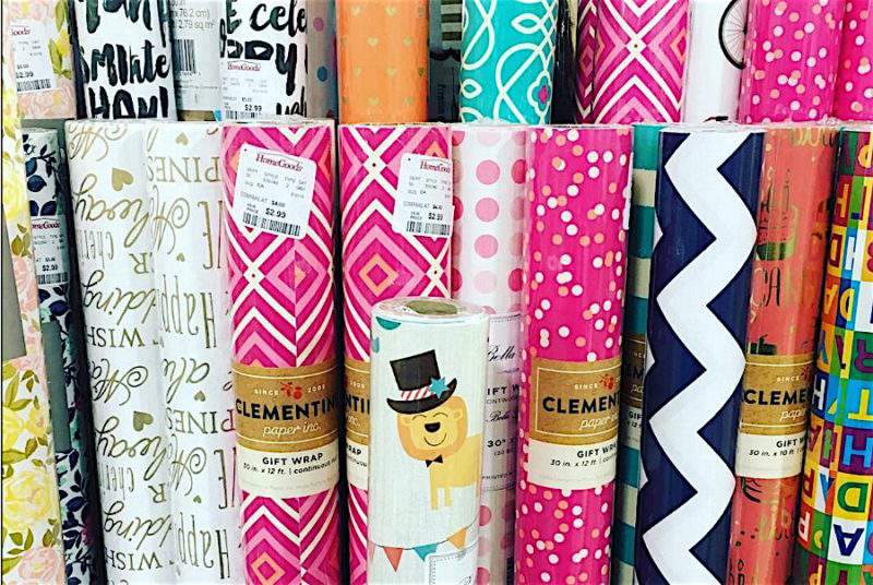 collection of colorful gift wrap rolls.