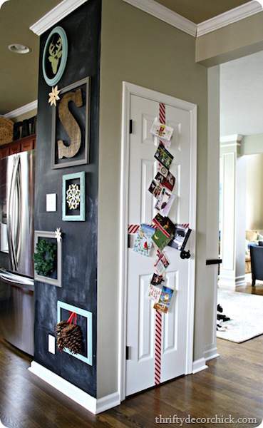 displaying cards on a door using holiday ribbon.