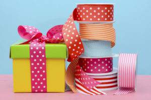 colorful wrapped gifts and ribbon.
