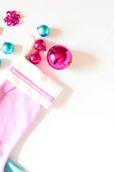 pink and blue stockings with christmas ornaments.