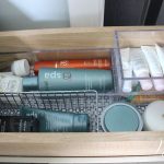 organized bathroom vanity drawer using drawer organizers.