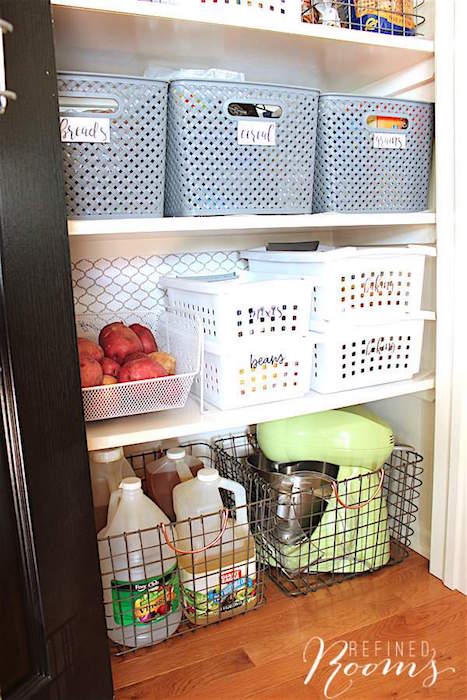 kitchen organization products - stackable baskets used in a pantry.