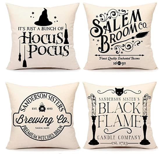 set of farmhouse-style Halloween-themed pillows.