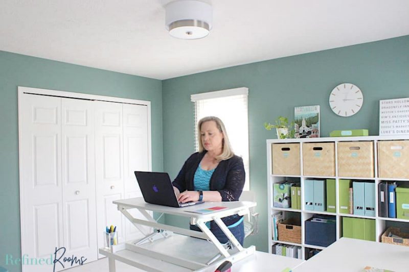 woman in home office at standing desk