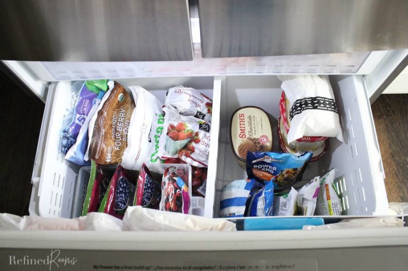 Bottom Freezer drawer pulled out to reveal organized food storage